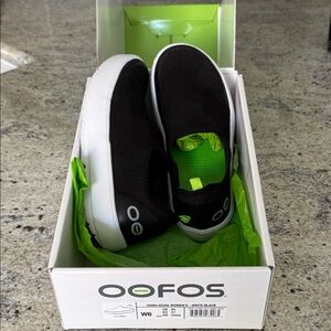 OOFOS Women's Black and White Slip-On Sneakers